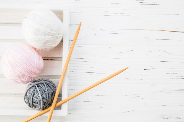 High angle view of colorful yarns and crochet