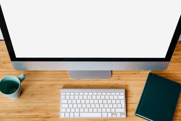 High angle view of computer with blank white screen