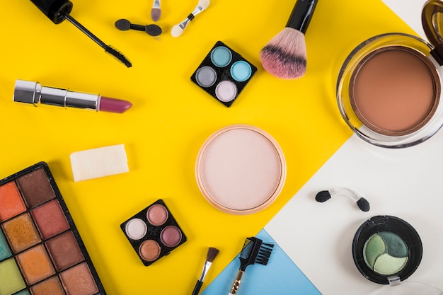 High angle view of cosmetic products on colorful background