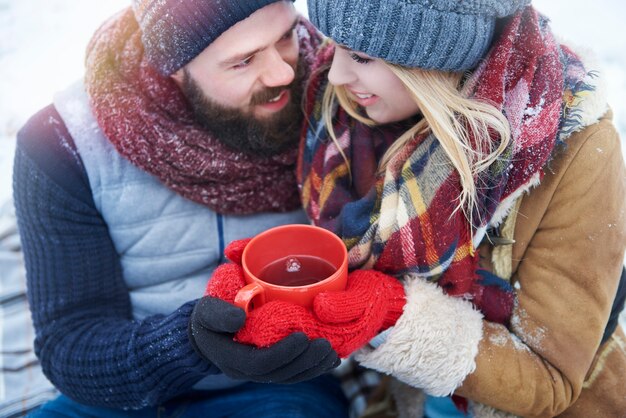 High angle view at couple with hot tea