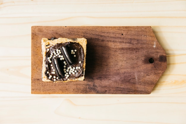 High angle view of delicious pastry on wooden chopping board