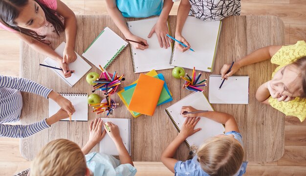high angle view of drawing kids