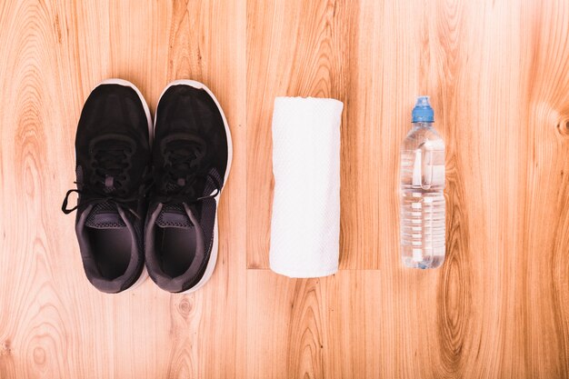 High angle view of fitness equipments on wooden floor