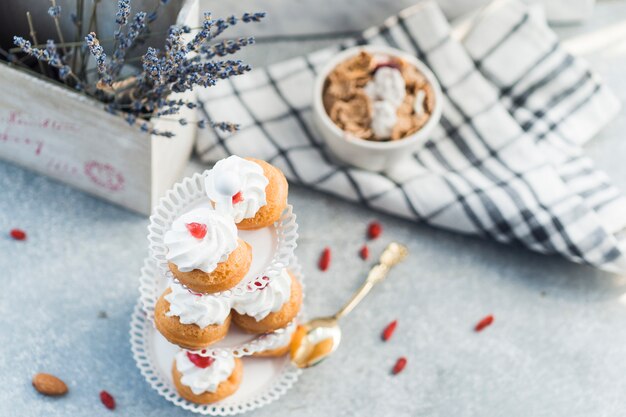 High angle view of fresh muffins on concrete backdrop