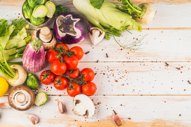 High angle view of fresh vegetables on wooden background