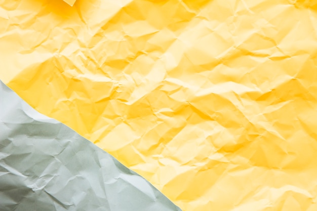 Free photo high angle view of grey and yellow paper background