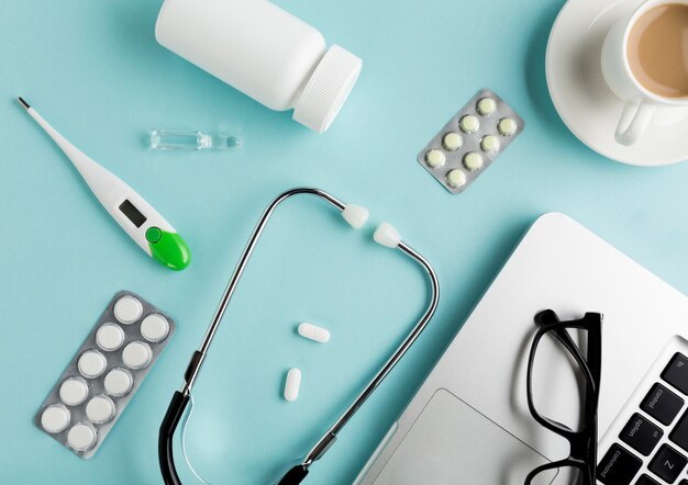 High angle view of healthcare equipment on blue desk