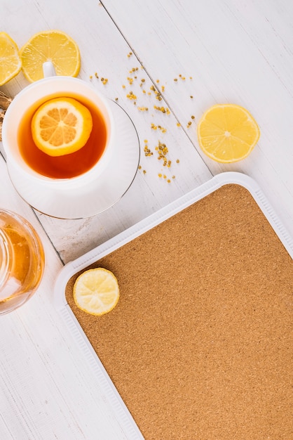 High angle view of lemon tea on wooden surface