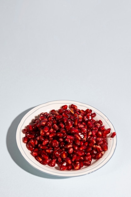High angle view of pomegranate seeds on plate