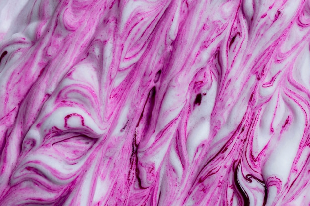 High angle view of purple abstract white marble textured backdrop