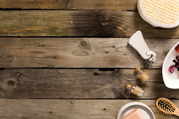 Free photo high angle view of spa products on wooden table