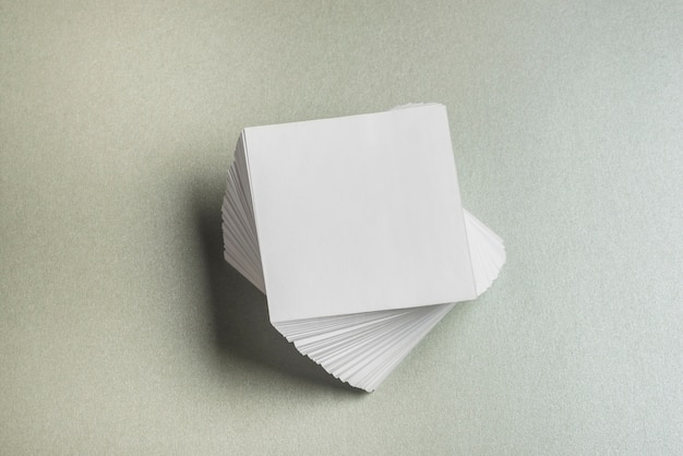 High angle view of stacked square shaped paper