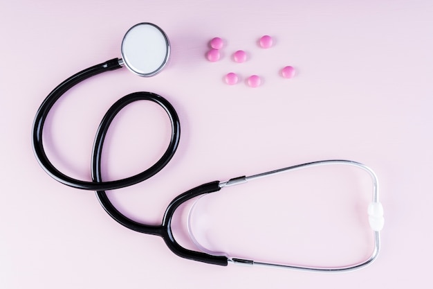 High angle view of stethoscope and medical pills