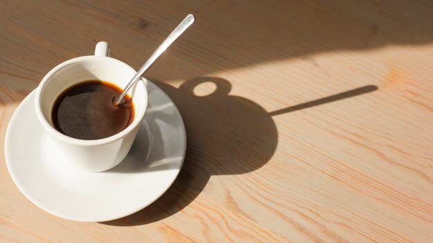 High angle view of tasty espresso coffee on wooden surface