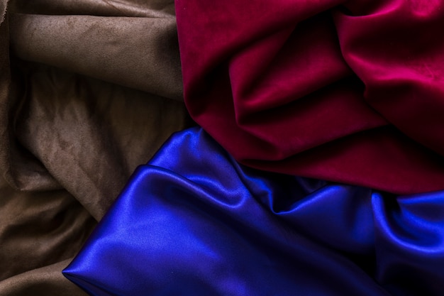 High angle view of three colorful silky drapes