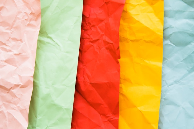 Free photo high angle view of various colorful crumpled papers