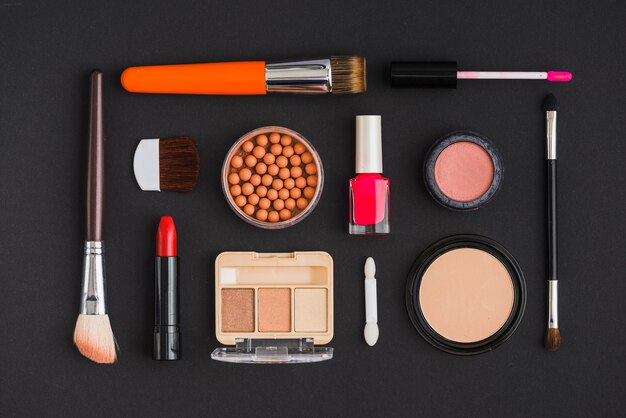 High angle view of various cosmetic products arranged in rectangular shape