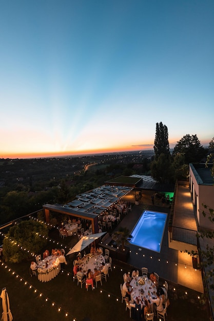 Free photo high angle view of wedding celebration at sunset. copy space.