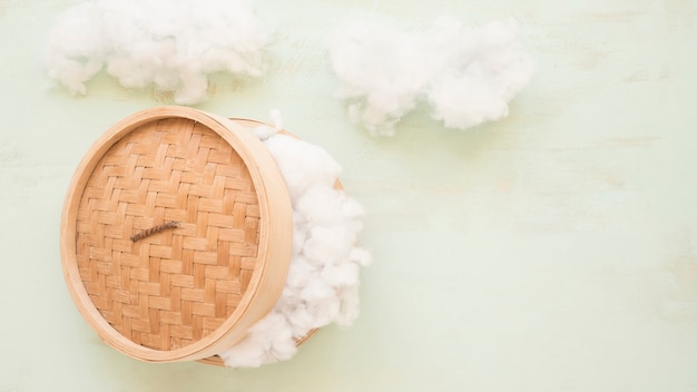 High angle view of a wicker steamer with white cotton