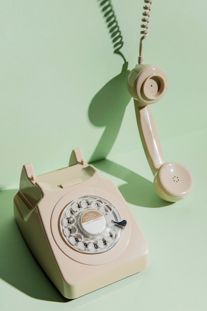 High angle of vintage telephone with receiver