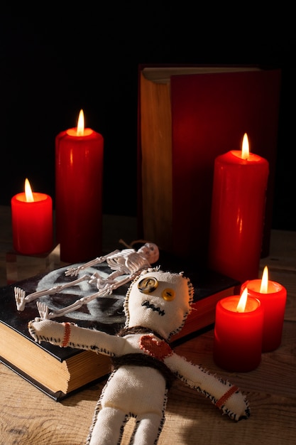 Free photo high angle vodoo doll with candles