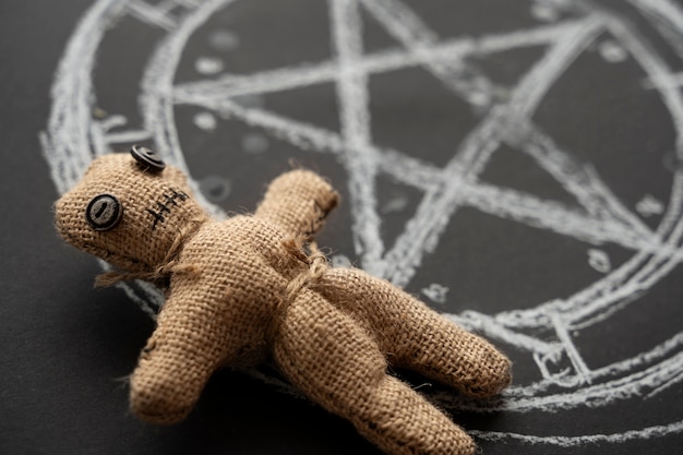 Free photo high angle voodoo doll on dark background