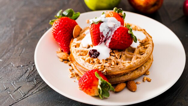 high angle waffles with strawberries and yogurt