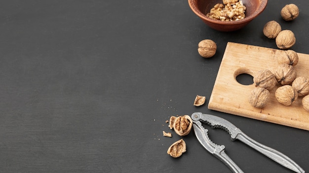 High angle of walnuts with cracker and copy space