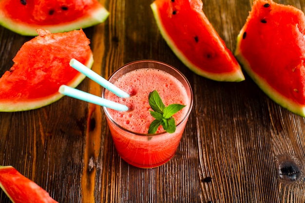 High angle watermelon slices and juice