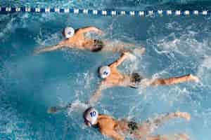 Free photo high angle  waterpolo  player in pool