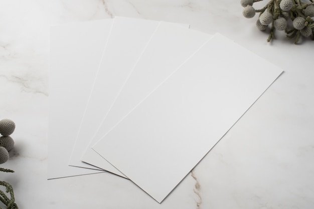 High angle of wedding paper with dried plant