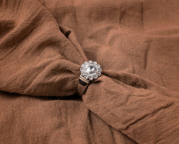 High angle wedding ring and cloth