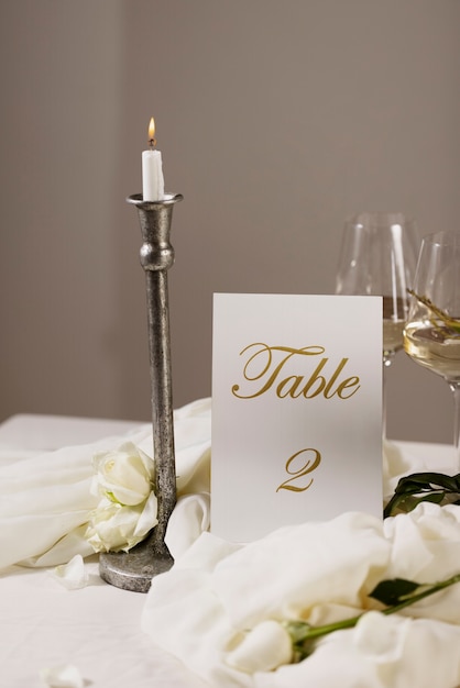 High angle wedding table number with candle