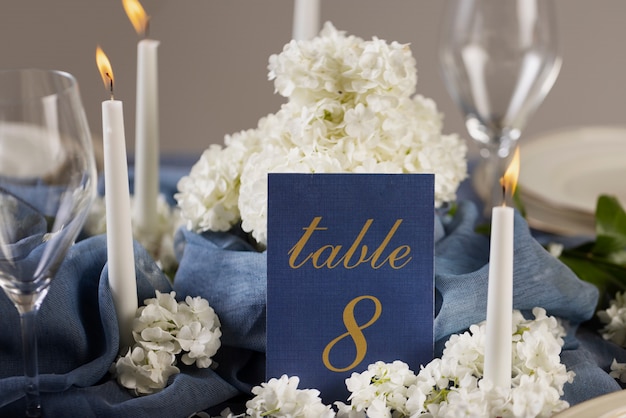 High angle wedding table number with candles