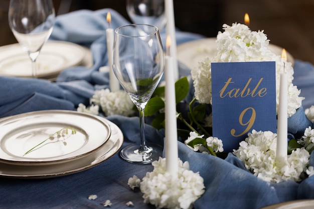 Free photo high angle wedding table number with cloth