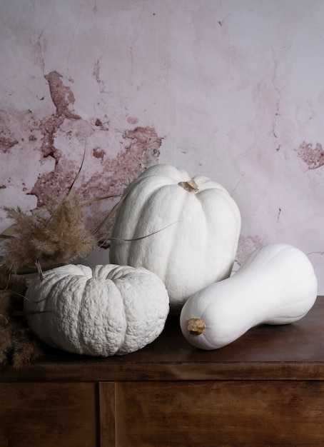 High angle white pumpkins arrangement on cabinet