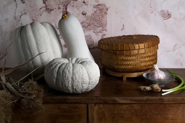 High angle white pumpkins and basket