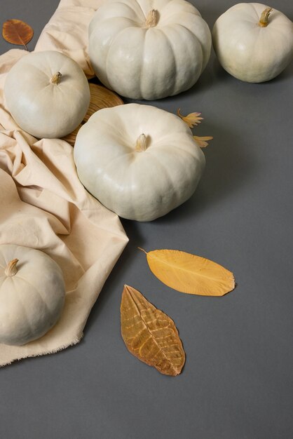 High angle white pumpkins and cloth arrangement