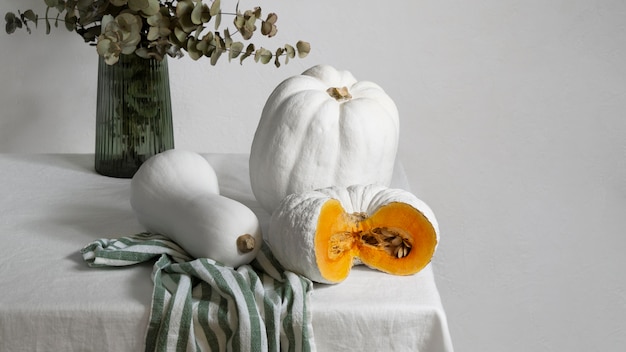 High angle white pumpkins on cloth