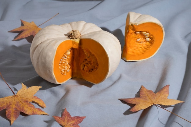 High angle white pumpkins and leaves