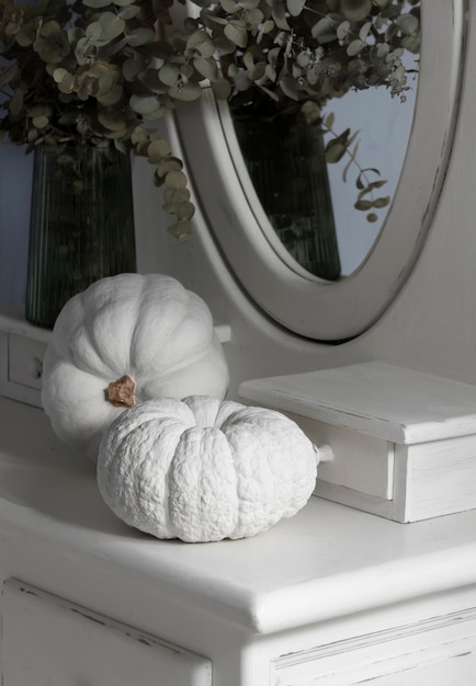 High angle white pumpkins and plants