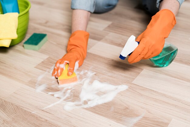 High angle of woman cleaning the floors
