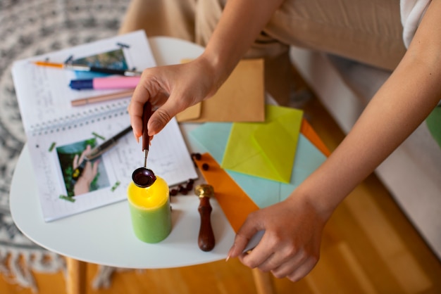 Free photo high angle woman doing creative journaling