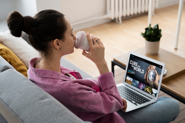 Free photo high angle woman drinking coffee