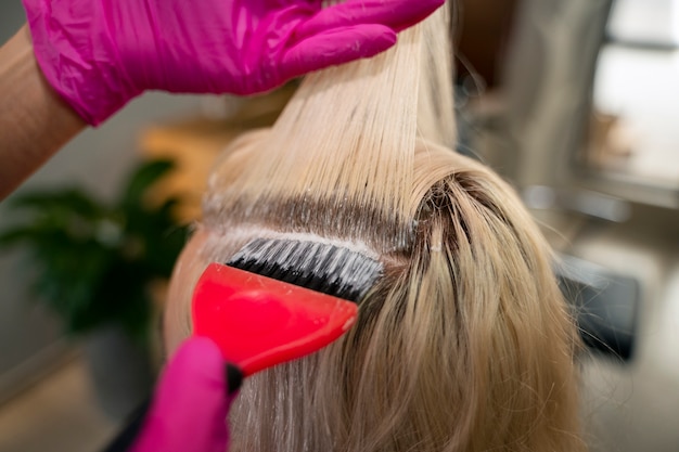 Free photo high angle woman at hair salon