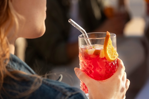 Free photo high angle woman holding sangria