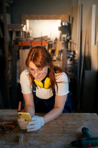 High angle woman holding smartphone