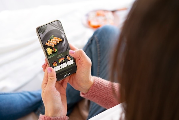 High angle woman holding smartphone