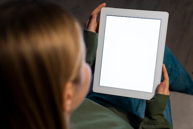 High angle of woman holding tablet