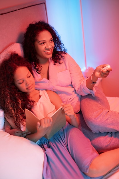 High angle woman and kid relaxing at home